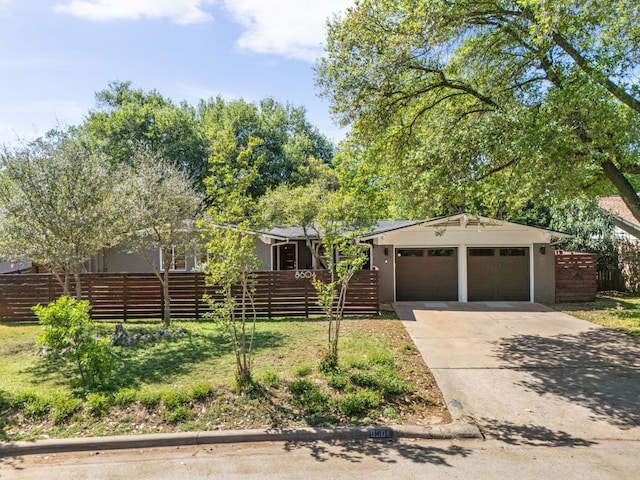 8604 Primrose Ln, Austin, TX 78757 - view of front of house with driveway and an attached garage