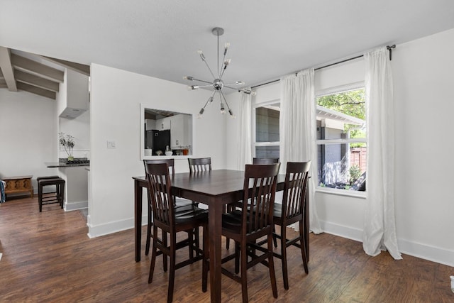 8604 Primrose Ln, Austin, TX 78757 - dining area featuring a chandelier and wood finished floors