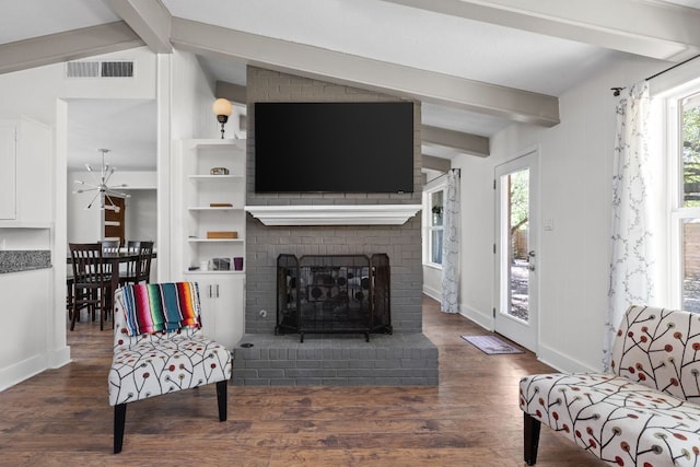 8604 Primrose Ln, Austin, TX 78757 - living room featuring wood finished floors and a fireplace