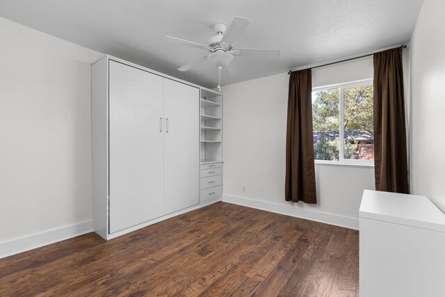 8604 Primrose Ln, Austin, TX 78757 - unfurnished bedroom featuring dark wood-style floors, a closet, and a ceiling fan