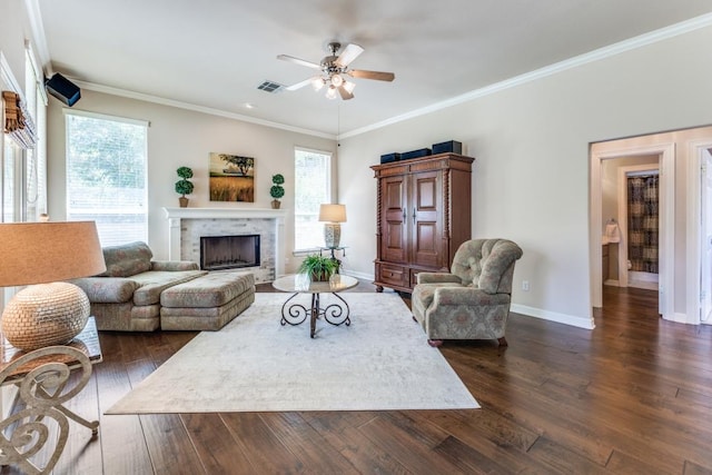 402 Palos Verdes Dr, Lakeway, TX 78734 - living area with ceiling fan, dark wood-style floors, a fireplace, baseboards, and ornamental molding