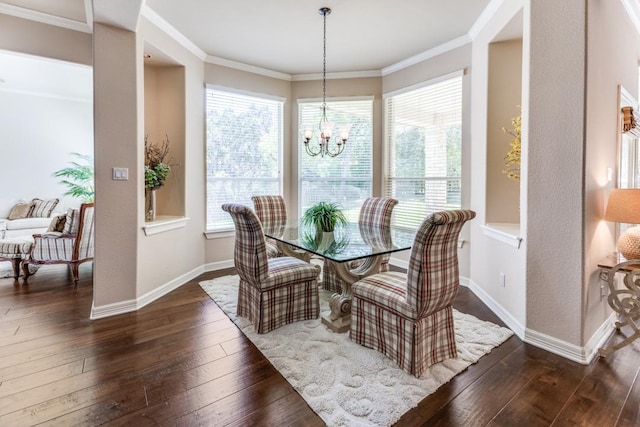 402 Palos Verdes Dr, Lakeway, TX 78734 - dining space with dark wood-type flooring, a chandelier, baseboards, and crown molding