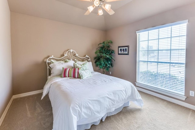 402 Palos Verdes Dr, Lakeway, TX 78734 - bedroom with carpet flooring, multiple windows, baseboards, a ceiling fan, and vaulted ceiling