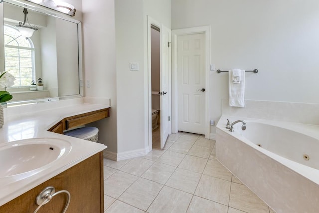 402 Palos Verdes Dr, Lakeway, TX 78734 - full bath featuring tile patterned flooring, a jetted tub, vanity, and baseboards