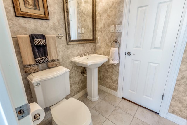 402 Palos Verdes Dr, Lakeway, TX 78734 - bathroom featuring baseboards, toilet, tile patterned flooring, and a sink