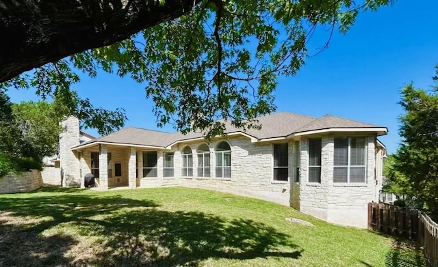 402 Palos Verdes Dr, Lakeway, TX 78734 - rear view of property with stone siding and a chimney
