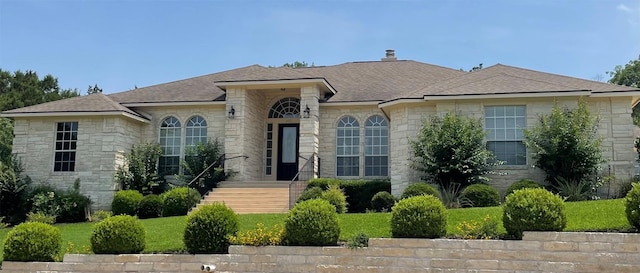 402 Palos Verdes Dr, Lakeway, TX 78734 - french country style house featuring stone siding, a chimney, and a shingled roof