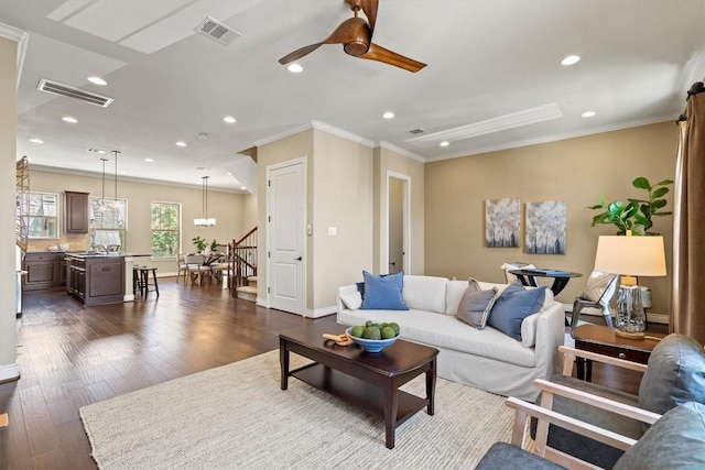 1025 Highknoll Ln, Georgetown, TX 78628 - living room featuring visible vents, recessed lighting, crown molding, and ceiling fan