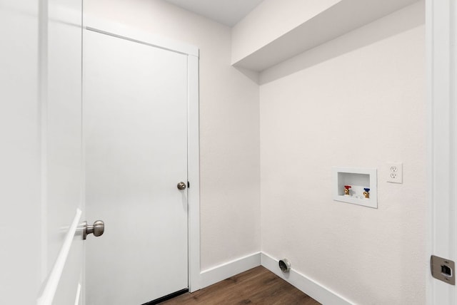 9005 Quail Creek Dr, Austin, TX 78758 - laundry room with dark wood finished floors and washer hookup
