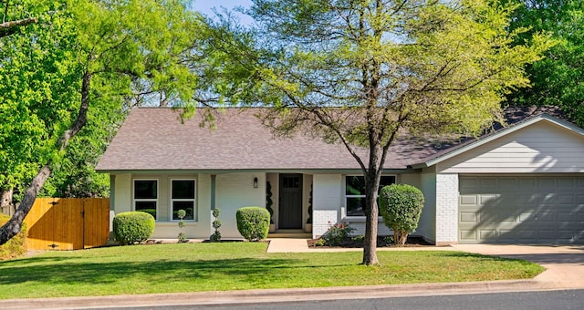 9005 Quail Creek Dr, Austin, TX 78758 - view of front of house with an attached garage, driveway, roof with shingles, and brick siding