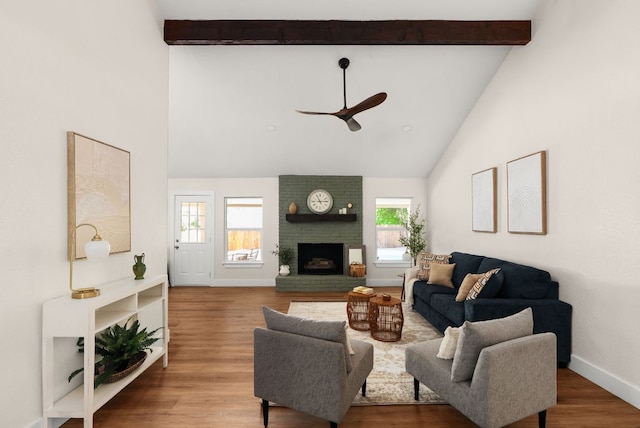 9005 Quail Creek Dr, Austin, TX 78758 - living area featuring a ceiling fan, high vaulted ceiling, beam ceiling, a fireplace, and wood finished floors
