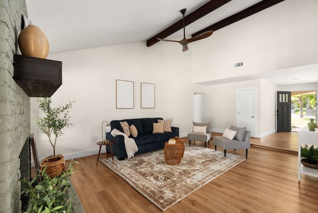 9005 Quail Creek Dr, Austin, TX 78758 - living area with ceiling fan, light wood finished floors, beamed ceiling, and high vaulted ceiling