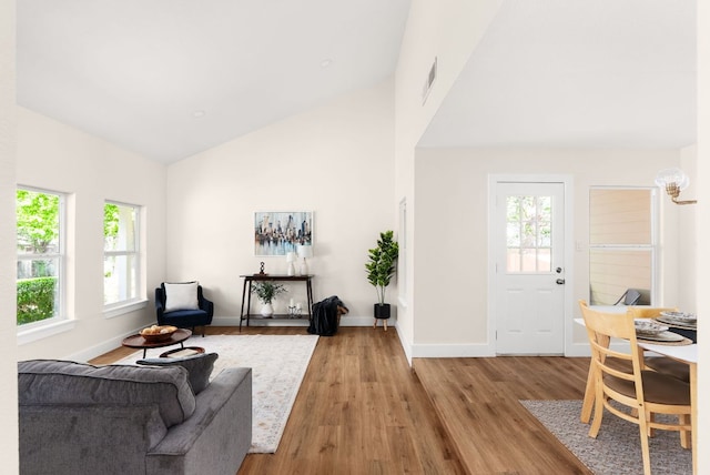 9005 Quail Creek Dr, Austin, TX 78758 - living area with high vaulted ceiling and light wood finished floors