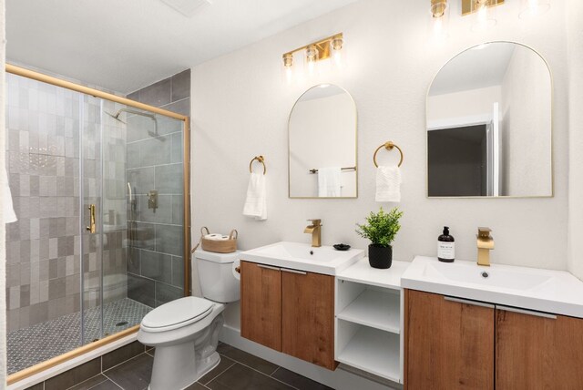 9005 Quail Creek Dr, Austin, TX 78758 - full bath with vanity, tile patterned flooring, and a stall shower