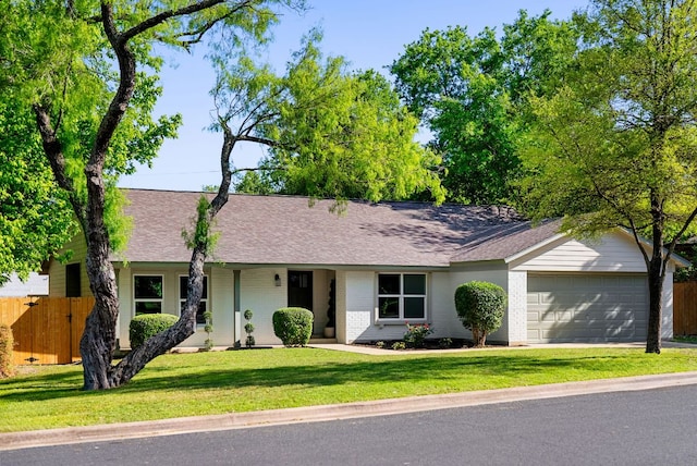 9005 Quail Creek Dr, Austin, TX 78758 - ranch-style home with a shingled roof, a garage, brick siding, and concrete driveway