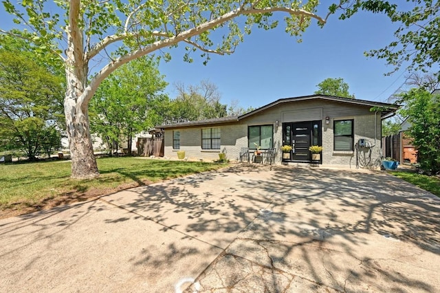 4607 S Forest Dr, Austin, TX 78745 - view of front of house with concrete driveway and brick siding