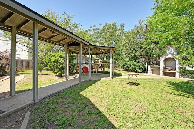 4607 S Forest Dr, Austin, TX 78745 - view of yard featuring exterior fireplace, a gazebo, and a patio
