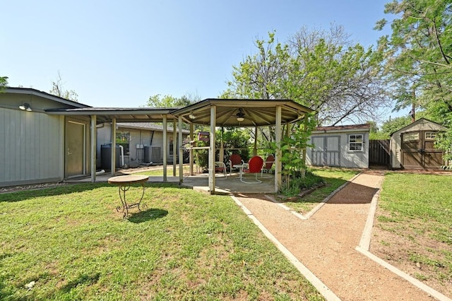 4607 S Forest Dr, Austin, TX 78745 - view of grassy yard featuring a storage shed and a patio area