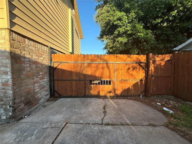 view of gate with fence