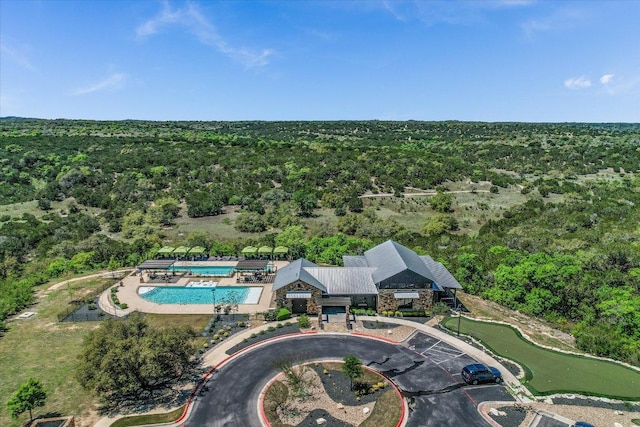 aerial view featuring a wooded view