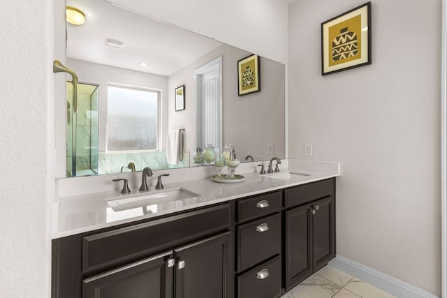 2348 Centennial Loop, Round Rock, TX 78665 - full bath featuring marble finish flooring, baseboards, and double vanity