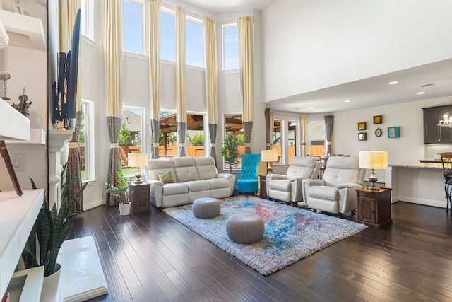 2348 Centennial Loop, Round Rock, TX 78665 - living room with a high ceiling, dark wood-type flooring, and baseboards