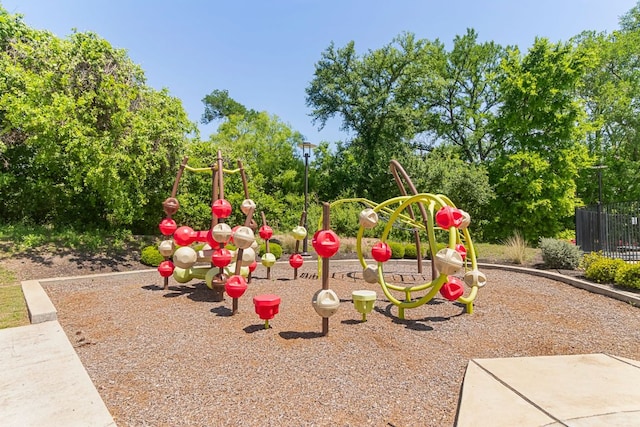 2348 Centennial Loop, Round Rock, TX 78665 - community play area with fence and view of wooded area