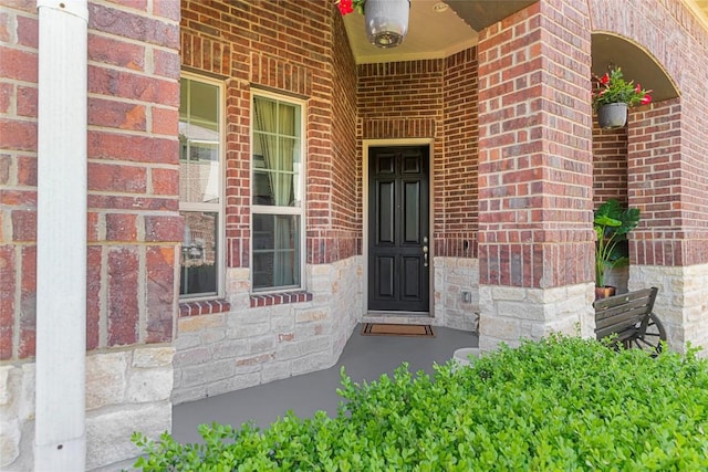 2348 Centennial Loop, Round Rock, TX 78665 - property entrance with brick siding and a porch