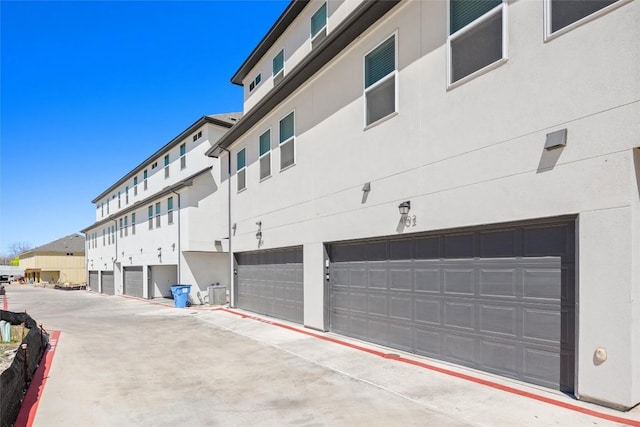 200 W 56th St Unit 4102, Austin, TX 78751 - view of building exterior featuring a garage