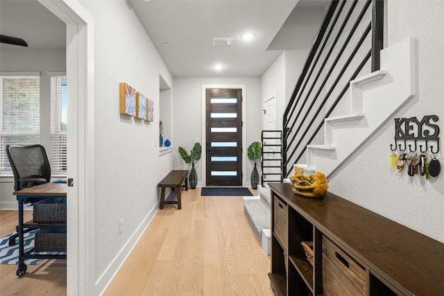 200 W 56th St Unit 4102, Austin, TX 78751 - foyer entrance featuring light wood-type flooring, stairs, and recessed lighting
