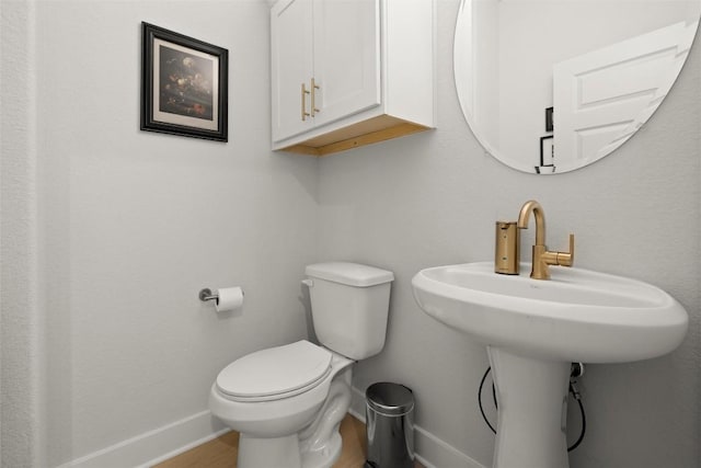 200 W 56th St Unit 4102, Austin, TX 78751 - bathroom with baseboards and wood finished floors