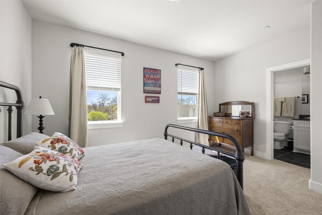 200 W 56th St Unit 4102, Austin, TX 78751 - bedroom featuring light carpet and connected bathroom