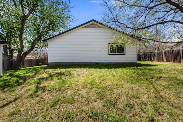 2702 Irish Bend Dr, Austin, TX 78745 - view of home's exterior featuring a fenced backyard and a lawn