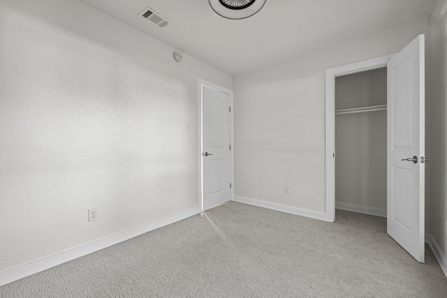 6107 Amber Pass, Austin, TX 78745 - unfurnished bedroom featuring light colored carpet, baseboards, and a closet