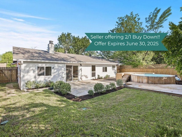 6107 Amber Pass, Austin, TX 78745 - back of house with a jacuzzi, a chimney, a patio area, a deck, and roof with shingles