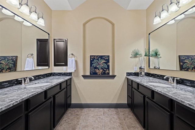 5612 Cherokee Draw Rd, Austin, TX 78738 - full bathroom with two vanities and tile patterned flooring