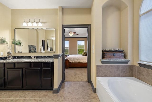 5612 Cherokee Draw Rd, Austin, TX 78738 - ensuite bathroom featuring vanity, a garden tub, tile patterned floors, and a ceiling fan