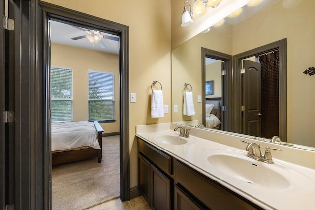 5612 Cherokee Draw Rd, Austin, TX 78738 - full bath featuring connected bathroom, ceiling fan, double vanity, and tile patterned floors