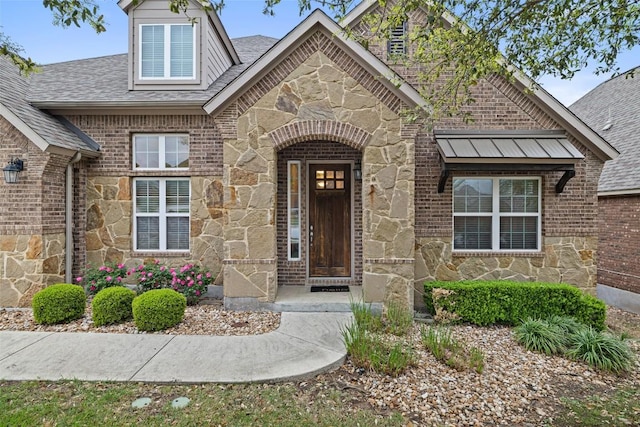 5612 Cherokee Draw Rd, Austin, TX 78738 - doorway to property with stone siding, a shingled roof, and brick siding