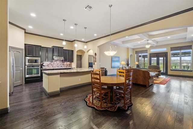 5612 Cherokee Draw Rd, Austin, TX 78738 - dining room featuring arched walkways, ceiling fan, crown molding, dark wood-style flooring, and recessed lighting