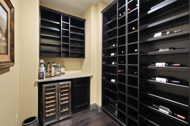 5612 Cherokee Draw Rd, Austin, TX 78738 - wine room featuring wine cooler, a dry bar, and dark wood-style flooring