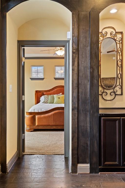 5612 Cherokee Draw Rd, Austin, TX 78738 - bedroom with arched walkways and wood-type flooring