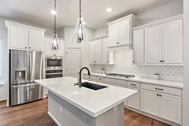 kitchen featuring decorative backsplash, stainless steel appliances, and a sink