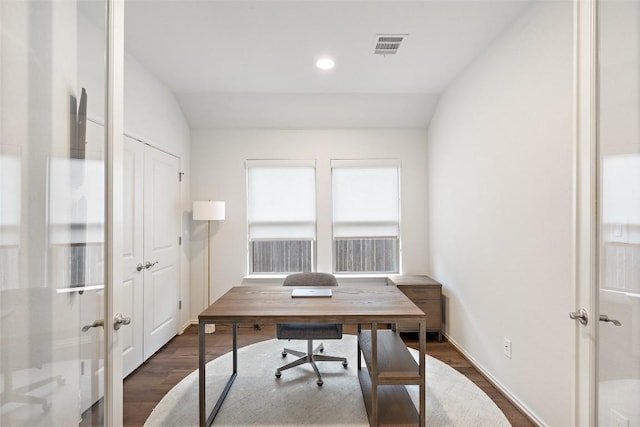 office with dark wood-type flooring, lofted ceiling, visible vents, and french doors