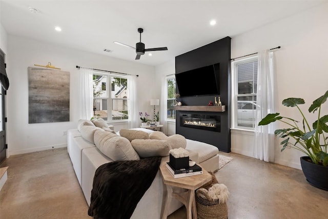 5701 Tura Ln Unit 1, Austin, TX 78721 - living room with a glass covered fireplace, ceiling fan, and recessed lighting