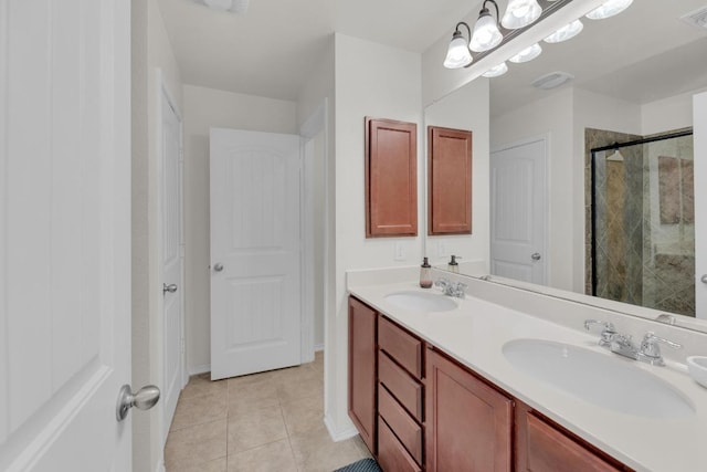 5812 Pescia St, Round Rock, TX 78665 - full bathroom featuring a shower stall, double vanity, tile patterned floors, and baseboards