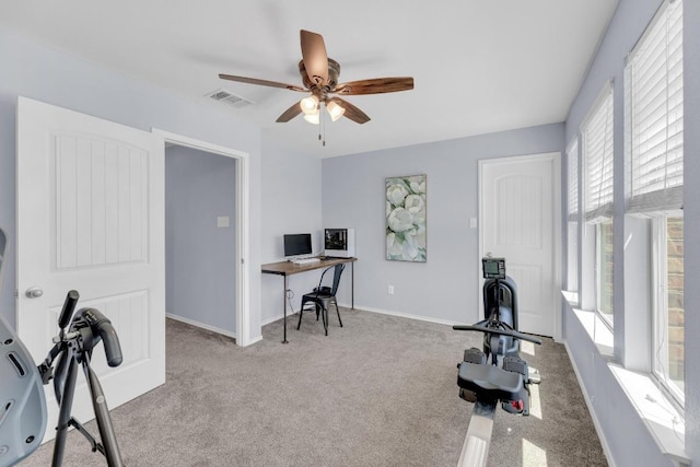 workout area featuring baseboards, a ceiling fan, visible vents, and carpet floors