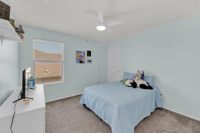 carpeted bedroom featuring baseboards and ceiling fan