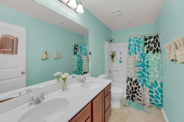 5812 Pescia St, Round Rock, TX 78665 - full bathroom featuring toilet, double vanity, tile patterned floors, and shower / tub combo