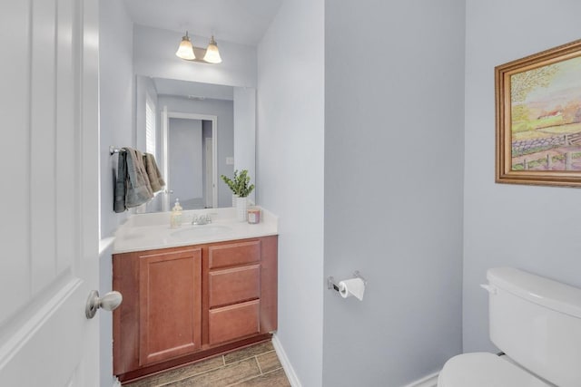 5812 Pescia St, Round Rock, TX 78665 - half bathroom featuring toilet, vanity, and baseboards